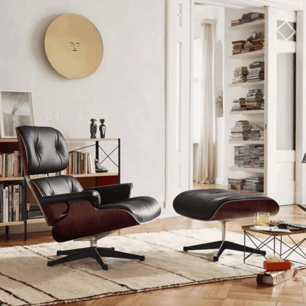 Modern lounge chair and ottoman in a stylish living room setting.